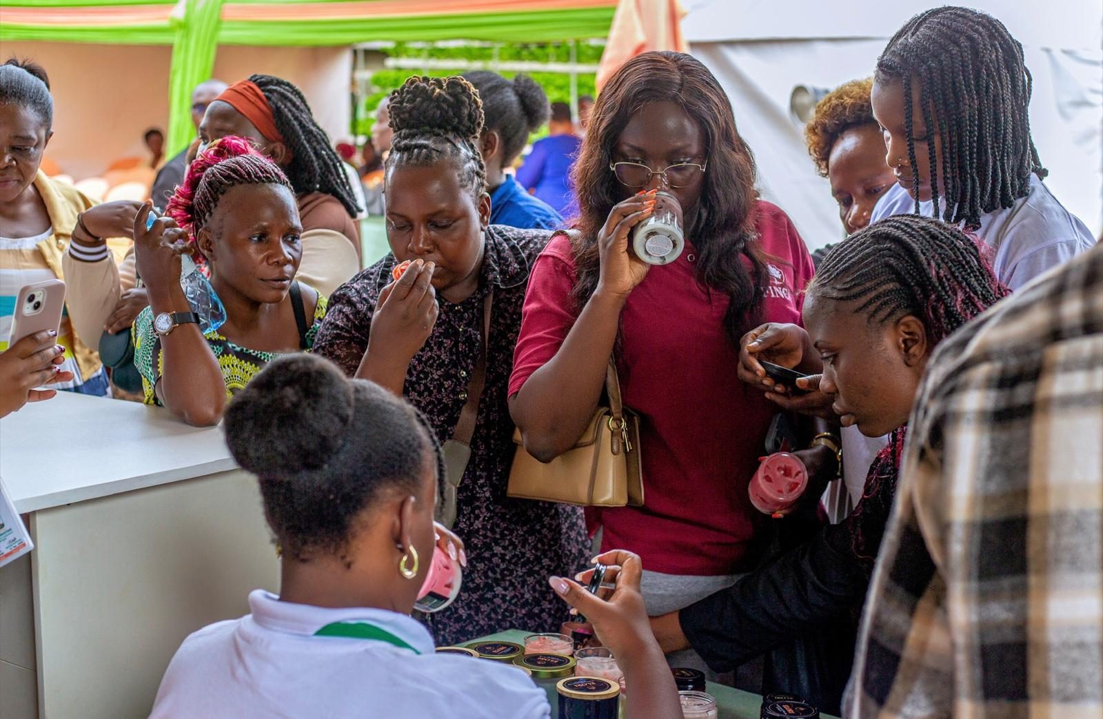Visitors sampling products made by women entrepreneurs